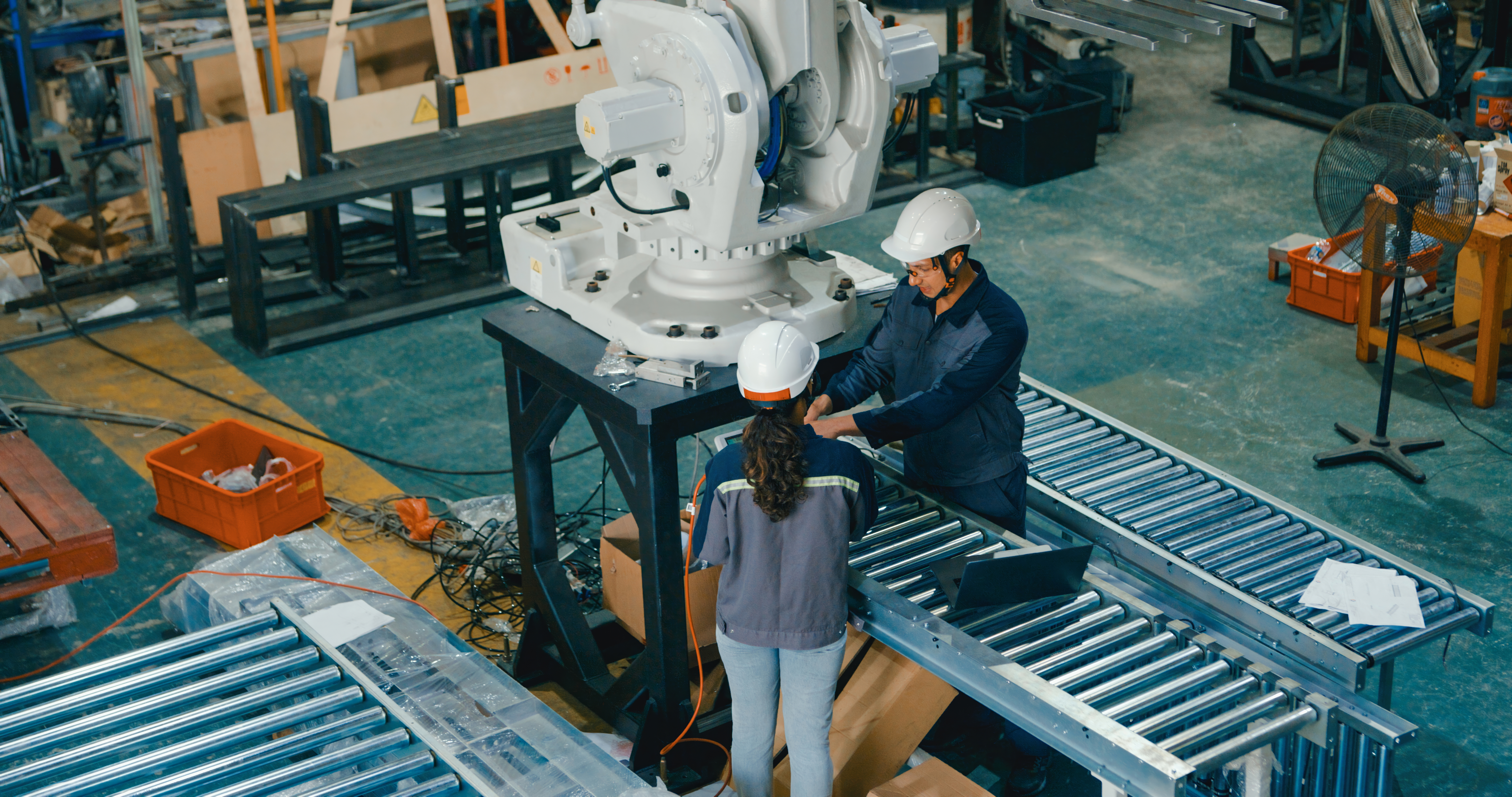 An industrial project support team from Level 3 Industrial coordinating tasks in a manufacturing plant.
